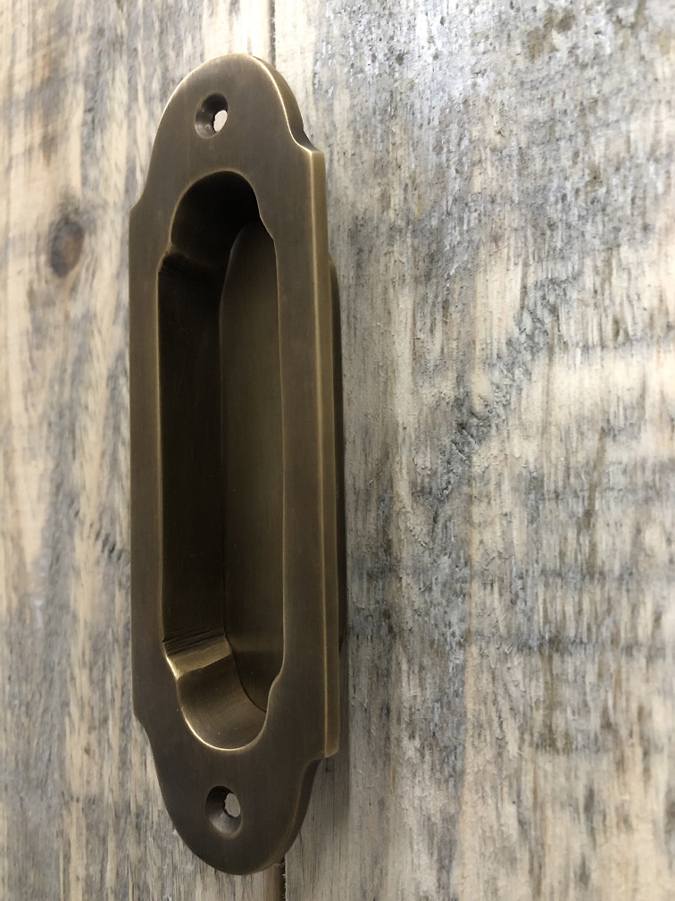 Sliding door handle - patinated brass - bowl handle