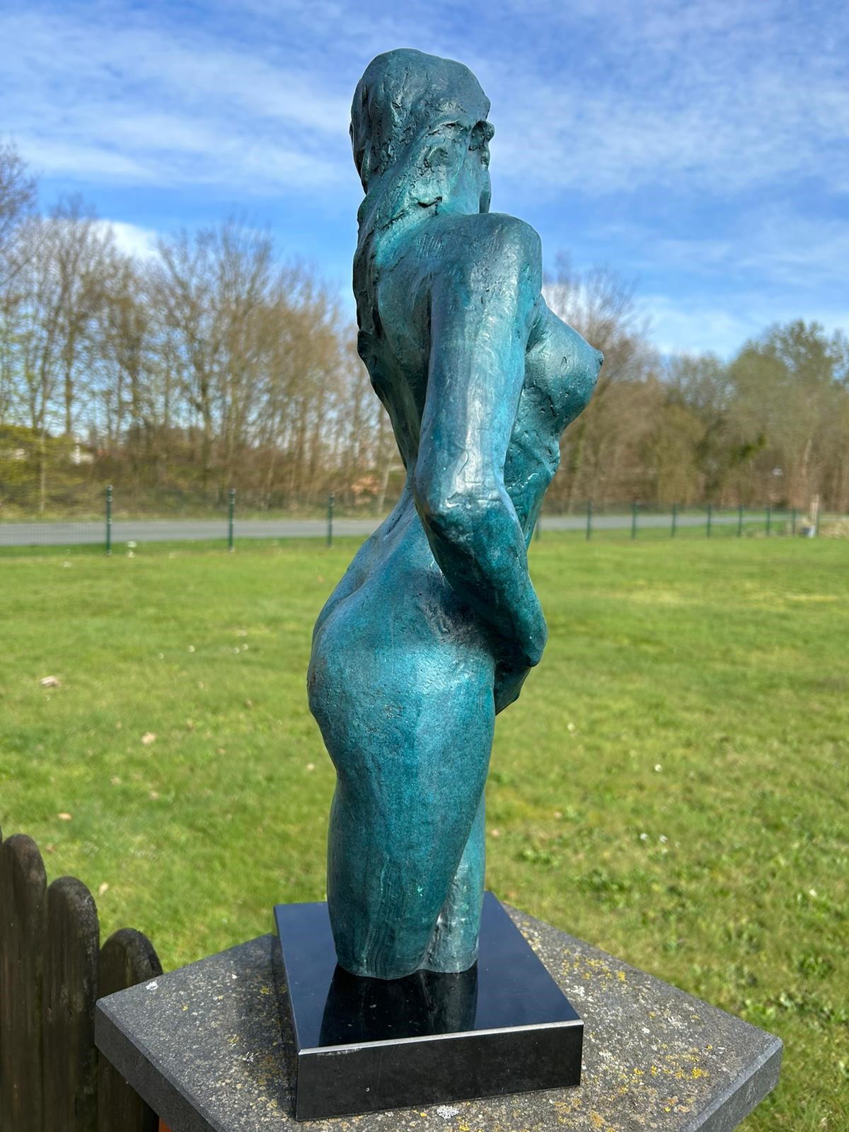 Elegant blue bronze statue of a nude woman on marble base