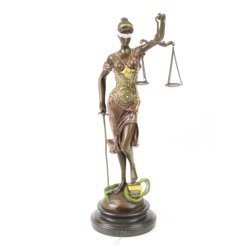 A bronze statue/sculpture of Lady Justice