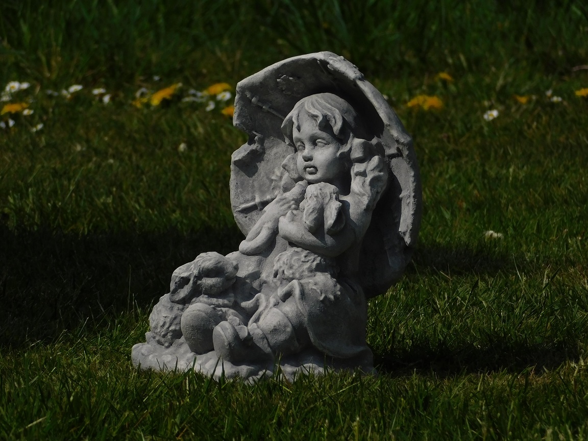 Statue girl with rabbits - solid stone