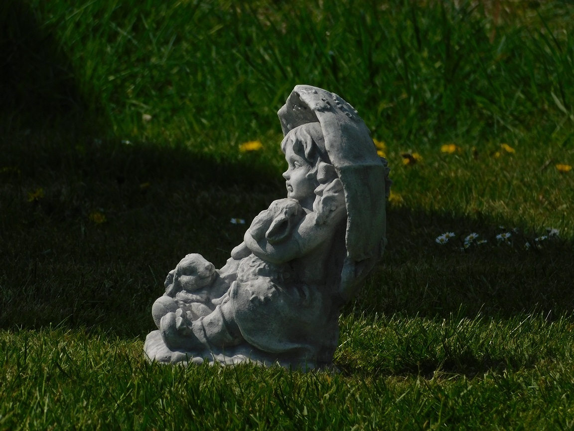 Statue girl with rabbits - solid stone