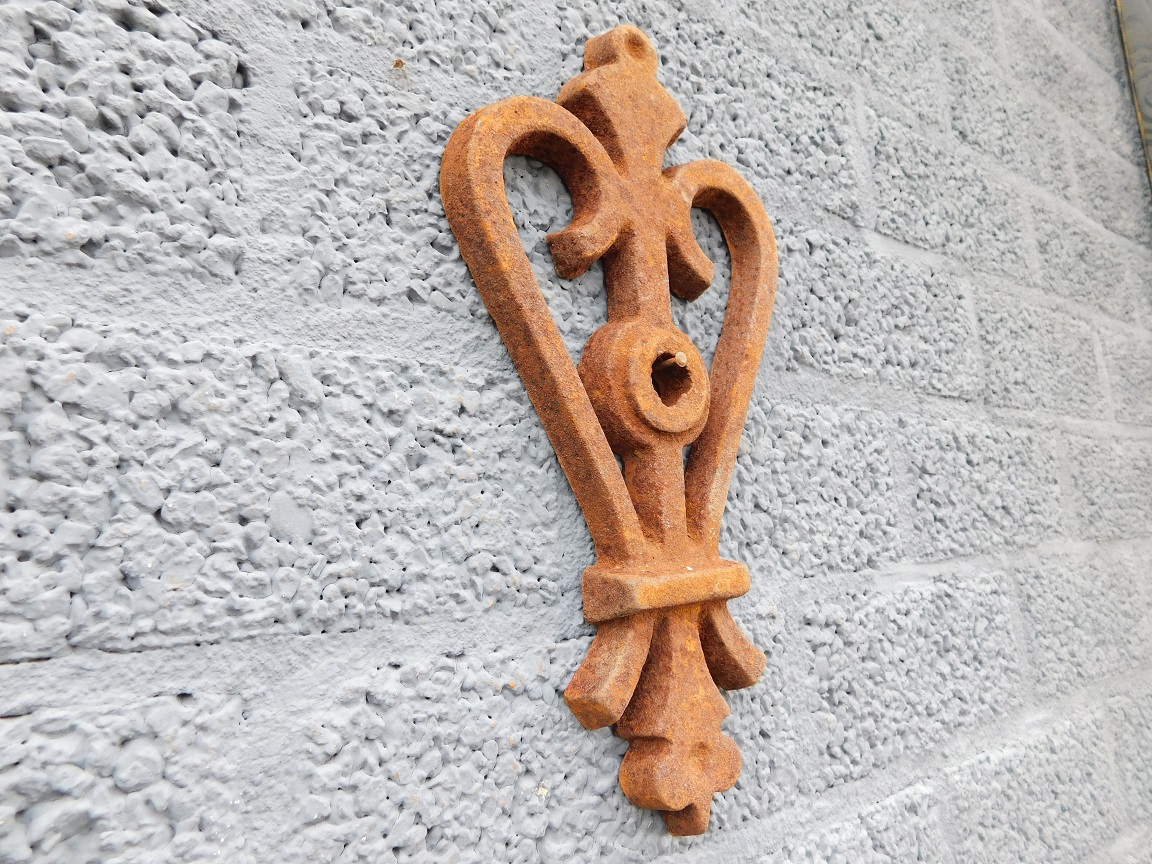 Wall anchor, cast iron, rust, heart shape.
