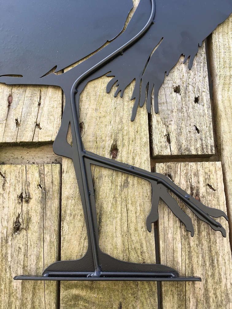 Prachtig silhouette van een reiger, mat zwart metaal