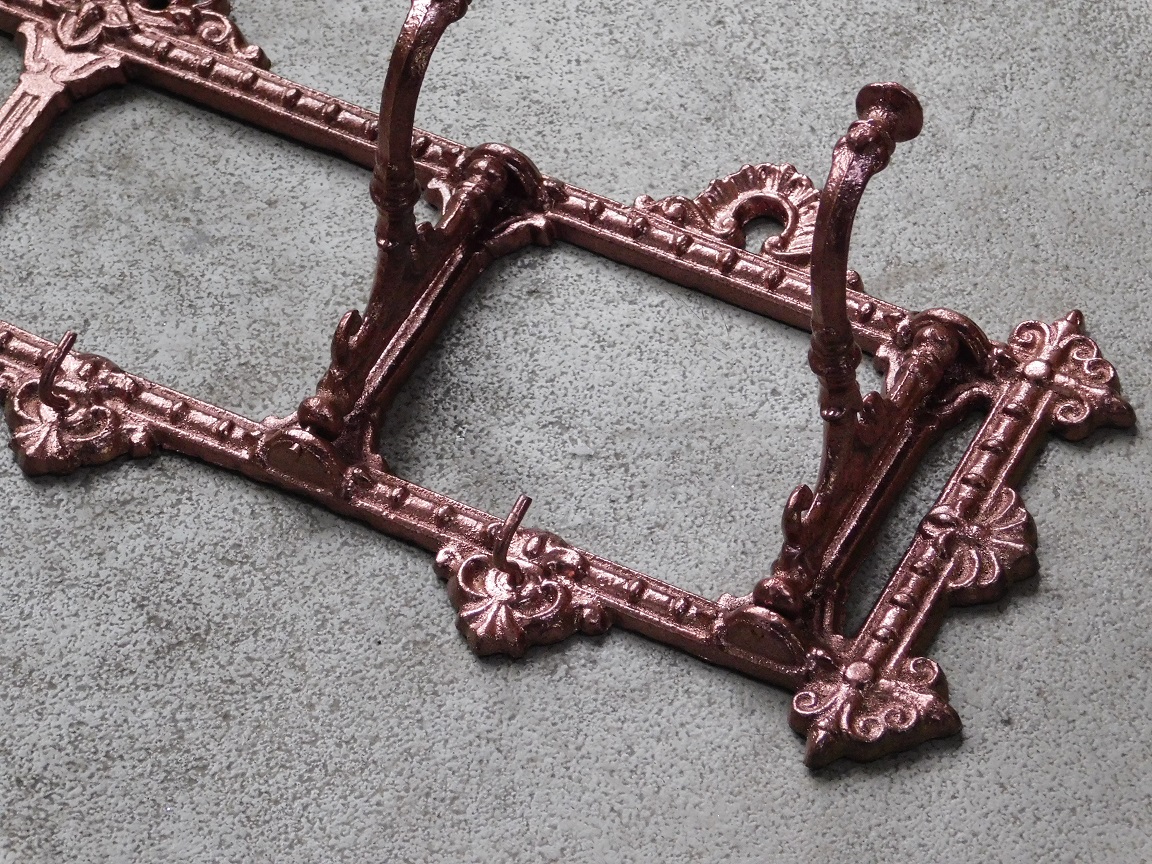 Coat rack with folding hooks - cast iron - copper look