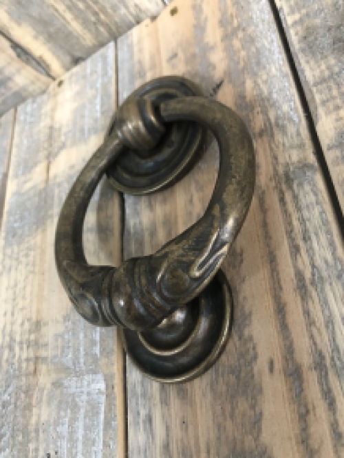 Door knocker, stylish and antique dark brass.