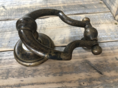 Door knocker, stylish and antique dark brass.