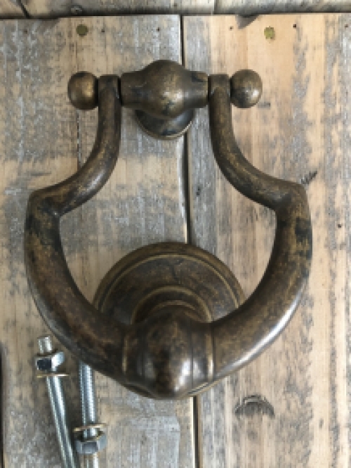 Door knocker, stylish and antique dark brass.