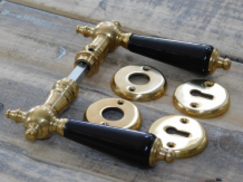 Set of door handles with rosettes - polished brass - with black ceramic handles