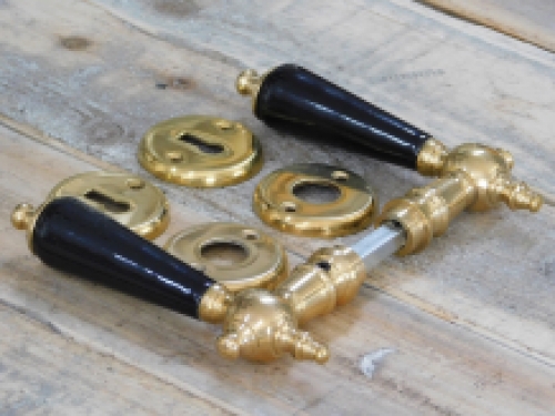 Set of door handles with rosettes - polished brass - with black ceramic handles