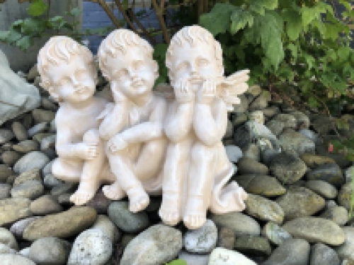 3 angels sitting in 1 row, very beautiful statue.