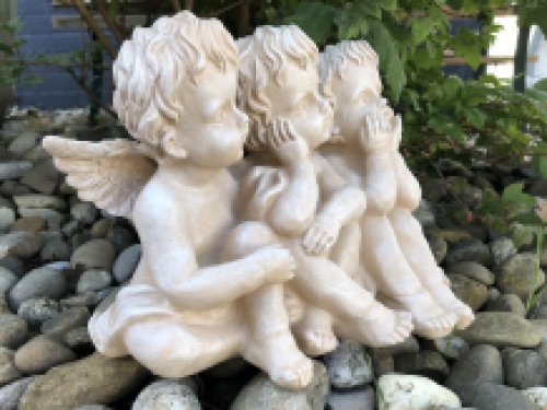 3 angels sitting in 1 row, very beautiful statue.