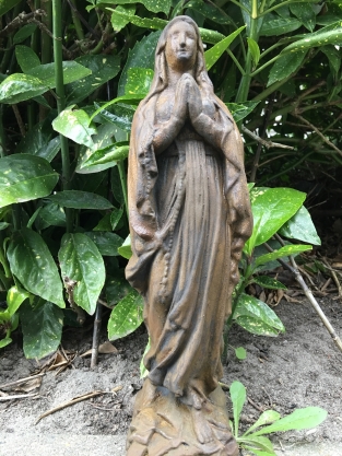 Statue of Mary full of stone, beautiful in detail, oxide color