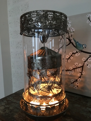 Beautiful metal lantern with separate rotating fire hood and cut glass.