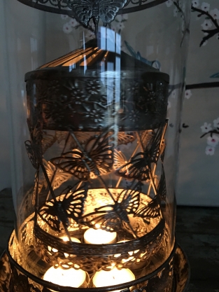 Beautiful metal lantern with separate rotating fire hood and cut glass.