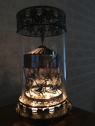 Beautiful metal lantern with separate rotating fire hood and cut glass.
