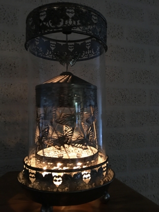 Beautiful metal lantern with separate rotating fire hood and cut glass.