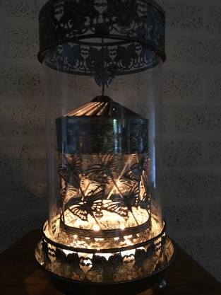 Beautiful metal lantern with separate rotating fire hood and cut glass.