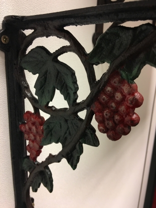 Beautiful shelf hanger with grape motif, cast iron-small