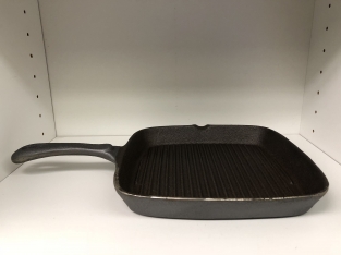 Heavy cast-iron grill pan, old-fashioned top quality.