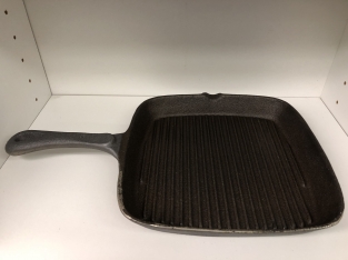 Heavy cast-iron grill pan, old-fashioned top quality.