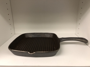 Heavy cast-iron grill pan, old-fashioned top quality.