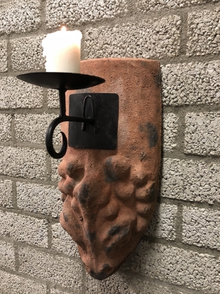 Wind light from roof tile with mythical image, with candlestick.