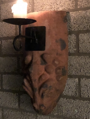 Wind light from roof tile with mythical image, with candlestick.