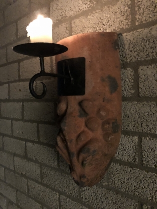 Wind light from roof tile with mythical image, with candlestick.