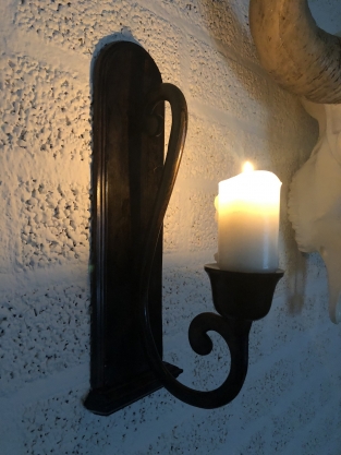 Beautiful dark brown heavy wrought iron wall sconce.