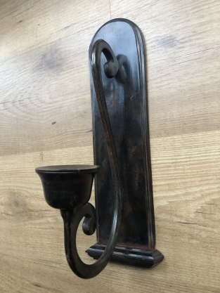 Beautiful dark brown heavy wrought iron wall sconce.