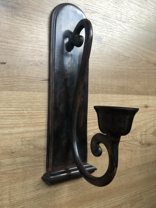 Beautiful dark brown heavy wrought iron wall sconce.