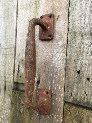 Door handle round-base made of solid iron - large- rust brown coated.