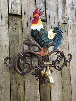 1 water hose holder rooster, cast iron with brass tap in color, beautiful.