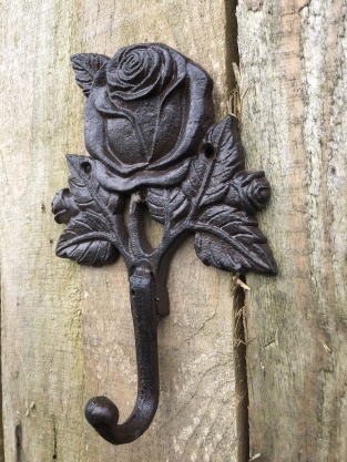 Coat rack with a rose, coat rack in cast iron, antique, brown