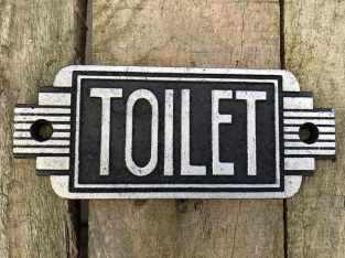 Cast iron sign ''Toilet'' in front of door