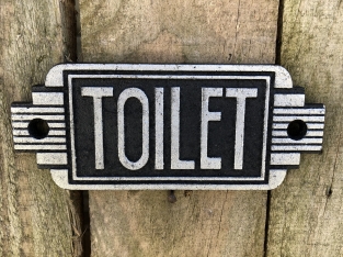 Cast iron sign ''Toilet'' in front of door