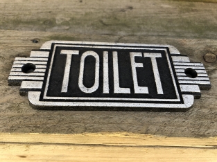 Cast iron sign ''Toilet'' in front of door