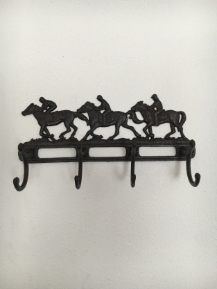 Coat rack with horses, 8 angles, cast iron