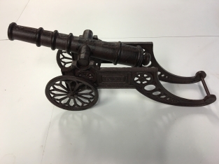 Beautiful decorative cannon, cast iron brown.