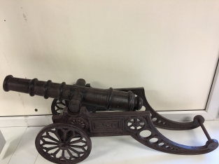 Beautiful decorative cannon, cast iron brown.