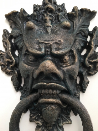 Cast iron door knocker with devil's head, very distinctive and beautiful!