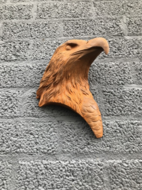 Eagle's head, cast iron wall ornament with rustic surface