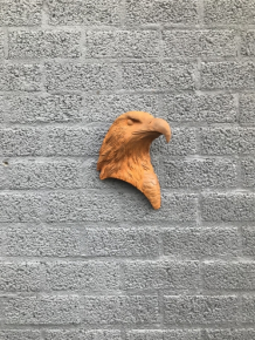 Eagle's head, cast iron wall ornament with rustic surface