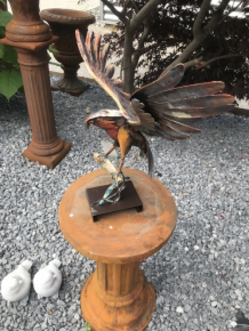 A metal artwork of an eagle catching a fish, ''IRON EAGLE''