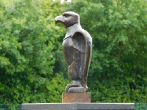 Eagle on wooden base - antique iron