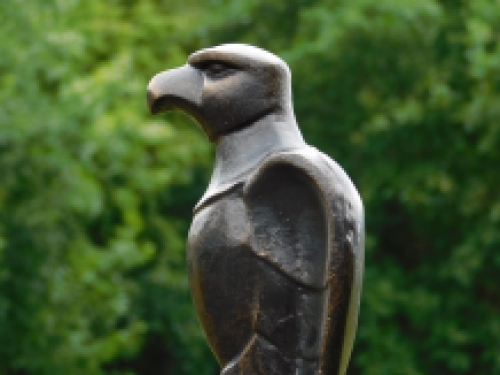 Eagle on wooden base - antique iron