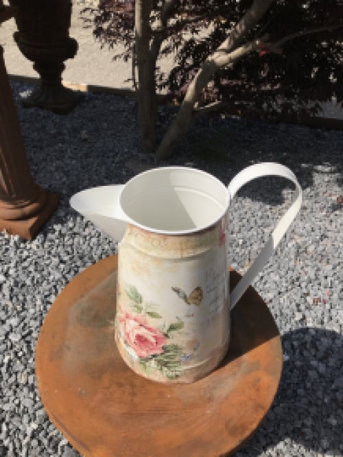 Large jug with beautiful images, made of metal