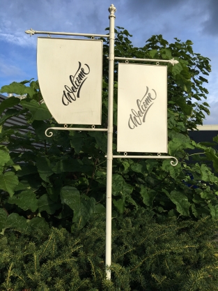 Welcome sign metal on stand, wrought iron white