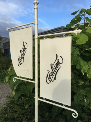 Welcome sign metal on stand, wrought iron white