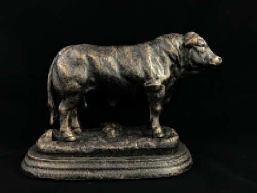 A beautiful statue of a bull, made of cast iron